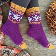 a woman's legs wearing purple and yellow socks