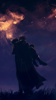 two people are standing in the dark with their arms around each other as they look up into the sky