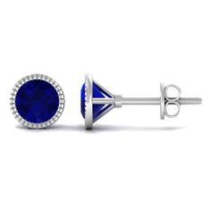 Product Details The Engraved Martini Stud Earrings adds a touch of sophistication to any outfit. The round cut Blue Sapphire gemstone sparkles and catches the light, making it a dazzling addition to your jewelry collection. Delicately crafted, this Blue Sapphire Stud Earring is the epitome of femininity and elegance. A perfect gift for a special woman in your life, this earring is sure to be cherished for years to come. Product Information SKU SHP-EARRINGS102026277 Length 6 mm Width 6 mm Weight Blue Halo Earrings For Formal Occasions, Formal Blue Halo Earrings, Blue Bezel Set Earrings For Formal Occasions, Blue Round Cut Earrings With Halo Setting, Blue Earrings With Halo Setting, Blue Round Cut Halo Design Earrings, Blue Round Cut Halo Earrings, Blue Halo Design Round Cut Earrings, Blue Halo Setting Round Cut Earrings