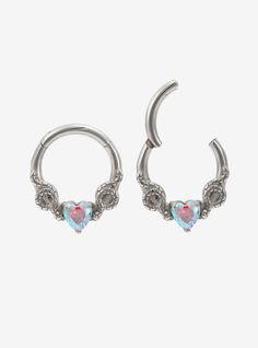 two heart shaped hoop earrings with crystal stones on each end and an open nose ring