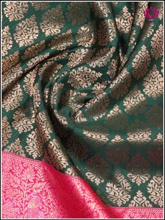 A Kanchipuram silk saree in an enchanting green hue highlights an ornate floral motifs on the body. The contrasting pinkish-red pallu showcases brocade designs, margined by lively parrot and peacock along with floral patterns provide a sense of natural beauty. The lush green shade represents freshness and vitality, while the intricate patterns add an element of traditional opulence. This saree incorporates bold pinkish-red double border. The cross striped border at the bottom complements the abo Festive Brocade Pre-draped Saree With Zari Weaving, Festive Pre-draped Brocade Saree With Zari Weaving, Festive Brocade Blouse Piece With Zari Weaving, Festival Brocade Saree With Zari Weaving, Anarkali Brocade Blouse With Zari Weaving, Anarkali Blouse Piece With Zari Weaving In Brocade, Brocade Pre-draped Saree With Self Design For Festivals, Green Pre-draped Saree With Motifs In Art Silk, Festive Brocade Saree With Zari Weaving