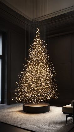 a lit christmas tree in a dark room