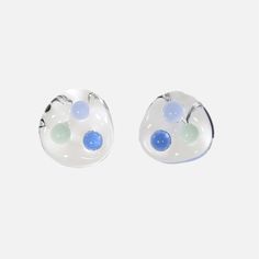 Small meets spunky with the KEANE Three Sphere Earrings. Handcrafted in the bustling city of New York using high-quality borosilicate glass, this unique piece adds a touch of wonder and magic to any outfit. It is perfect for fashion-forward individuals who appreciate the art of handcrafting and crave to make a bold statement. Multi-Colored Borosilicate Glass Because of the nature of handmade goods, color, size, and form may vary. Handmade in New York City Care instructions: Protect your pieces from impact or bending. Modern Handmade Glass Earrings, Modern Round Glass Earrings, Modern Handmade Clear Earrings, Clear Glass Earrings For Pierced Ears, Modern Round Resin Earrings, Modern Glass Earrings, Party Glass Earrings In Clear Color, Sphere Earrings, Diamond Ear Cuff