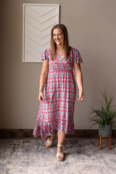 Introducing our Red V-Neck Floral Maxi Dress - a fun, cheerful dress perfect for all your summer adventures. Made with a lightweight fabric and a convenient snap closure on the v-neck, it's also a great option for nursing moms! Dress it up or down for any occasion. The Fit of This Boutique Hi-Low Maxi Dress: Pictured of a typical Small Top wearing the Small. See HOW TO MEASURE Here. TOP: Flat Across Measurements in Inches Size: Chest Across Waist Across Length Small 15 23 43 front/52 back Medium Playful Red Sundress For The Beach, Playful Red Dresses For Vacation, Playful Red Dress For Vacation, Casual Summer Nursing Friendly Dresses, Casual Nursing Friendly Summer Dresses, Red Short Sleeve Sundress For The Beach, Red Short Sleeve Sundress For Beach, Playful Red Vacation Dress, Casual V-neck Maxi Dress With Floral Print