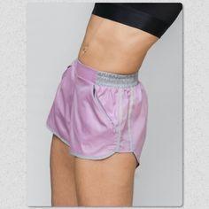 This Lightweight Ripstop Short Is Great For Summer! Two Invisible Smart-Angled Pockets Provide Ample Phone/Wallet/Keys Storage, While A Flat Front Tummy Panel Keeps The Look Sleek. Reflective Side Trim Keeps You Sage By Night And Fabulous By Day. Pair Them With The Matching Hooded Zip Up Jacket 100% Polyester Sz Xs-Xxl Summer Purple Athletic Shorts With Built-in Shorts, Purple Sports Shorts For Summer, Summer Purple Athletic Shorts With Elastic Waistband, Summer Athletic Shorts With Elastic Waistband In Purple, Purple Stretch Shorts With Elastic Waistband, Purple Gym Bottoms Short Length, Purple Workout Bottoms With Pockets, Purple Athletic Shorts With Pockets For Sports, Purple Gym Bottoms With Built-in Shorts