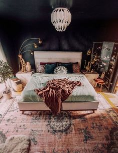 a large bed sitting on top of a rug in a bedroom