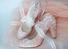 "Blush and ivory embellished lace wedding shoes for bride who wants to feel like a princess... These bridal shoes compliment your fairy tale wedding theme beautifully! Custom wedding gift, personalized engagement gift or bridesmaids shoes. Blush wedding heels are designed with ivory lace. Glass beads, shiny sequins and small pearls are used on the embroidery. \"I Do\" is added onto the soles with blue crystals for \"something blue\". Scattered small rhinestones add extra sparkle. Organza ribbons Pink Wedding Court Shoes, Wedding Shoes Bride Light Pink, Fairy Tale Wedding Theme, Blush Ivory Wedding, Pink Wedding Shoes Heels & Wedges, Lace Wedding Heels, Pink Wedding Shoes With 4-inch Heel, Glamorous Pink Wedding Shoes With 4-inch Heel, Sleeping Beauty Wedding