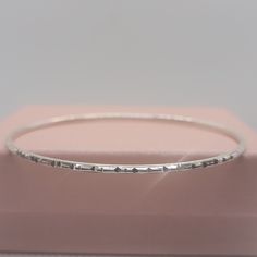 Elevate your style, your outfits, and your jewelry collection with this handmade solid S925 sterling silver diamond cut bangle bracelet. This stunning piece features intricate detailing that will make showcases craftsmanship, adds beauty to any outfit, and makes it a perfect gift. Please check out the chart in the photos to know your size. ◾D E T A I L S◾ ▪M A T E R I A L: This bangle bracelet is all handmade with care with the highest and bestest quality silver ▪D E S I G N: The design on this bangle bracelet it intricate, unique, and absolutely stunning and it is accomplished by diamond cuts.  ▪WHY YOU'LL LOVE IT: This unique sterling silver bangle bracelet is more than just a piece of jewelry; it's a statement of style and charm. The diamond cut design it stunning and gorgeous. Its beau Minimalist Hallmarked Sterling Silver Bracelet, Stackable Sterling Silver Bracelet For Anniversary, Adjustable Sterling Silver Bracelet With Diamond Cut As Gift, Stackable Sterling Silver White Gold Bangle, Stackable Sterling Silver Bangle In White Gold, Stackable White Gold Sterling Silver Bangle, Minimalist Sterling Silver Hallmarked Bracelet As Gift, Minimalist Sterling Silver Diamond Bracelet, Dainty Sterling Silver Bangle In Silver