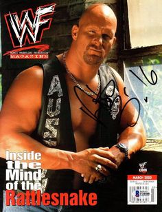 an autographed magazine cover with a wrestler posing for the camera and wearing a black vest