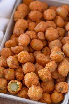 a pan filled with tater tots sitting on top of a table