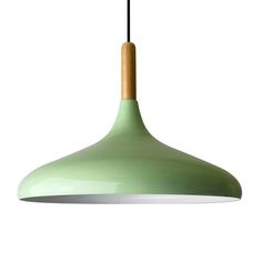 a green light hanging from a ceiling fixture with a wooden stick sticking out of it