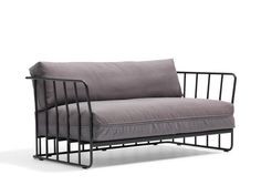 a gray couch sitting on top of a metal frame