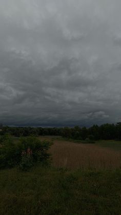 the sky is dark and cloudy as it appears to be overcasting in the distance