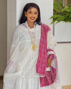 Indulge in the beauty of this modern Ethiopian Habesha dress, adorned in a gorgeous shade of pink. Its intricate design and exquisite craftsmanship create a visually stunning masterpiece. Perfect for special occasions or as a statement piece, this dress is a celebration of Ethiopian artistry and will leave a lasting impression wherever you go. Material Cotton Menen Thread Estimated delivery : 2 weeks to 4 weeks Contact WhatsApp +1(304)-306-2784Email: contact@ethiopian.store Ethiopian Dress, Habesha Kemis, Pink Design, Modern Dress, Wedding Art, Turks And Caicos Islands, Bosnia And Herzegovina, Trinidad And Tobago, Wedding Couples