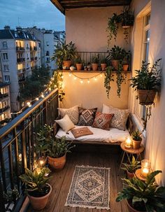 a balcony with potted plants and lights