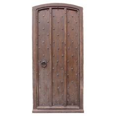 an old wooden door with metal rivets on the front and side, isolated against a white background