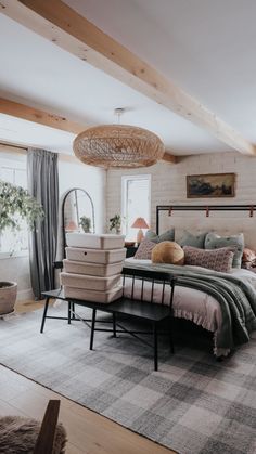 a bedroom with a large bed and lots of pillows