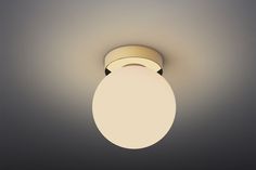 a light that is on in the ceiling with a dim lighting fixture above it and below it