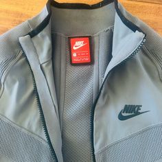 In Very Good Condition. Rarely Worn Xs But Fits More Like A Small Super Rare! Lightweight Material Fitted Sportswear Outerwear With Ribbed Cuffs, Fitted Sports Outerwear With Ribbed Cuffs, Nike Long Sleeve Outerwear For Light Sports, Nike Long Sleeve Track Jacket For Light Sports, Nike Functional Track Jacket For Light Sports, Fitted Sports Track Jacket With Pockets, Athleisure Track Jacket With Pockets For Light Sports, Fitted Casual Outerwear For Light Sports, Nike Winter Outerwear For Light Sports