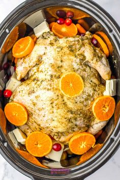 a whole chicken in an instant pot with oranges and cranberries