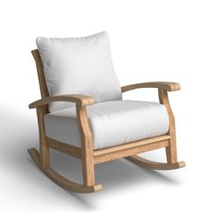 a wooden rocking chair with white cushions