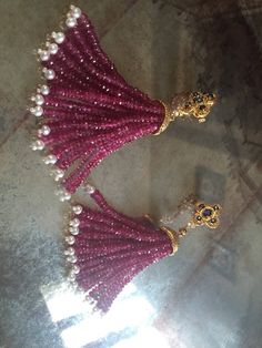 Elegant Stunning Ruby Chandelier Earrings with Blue Sapphire and Diamonds Approx Details Exact Details after making might vary slightly 14k Gold : 16 gms Pearl : 12.00 cts Diamonds : 1.8 cts Diam. Second : 0.18 cts Blue Sapphire Sapp. : 2.34 cts Ruby Beads : 150 carats High Luster Drop Earrings For Party, Shiny Drop Earrings For Party, Traditional Dangling Beads Earrings For Reception, Party Temple Jewelry Earrings With Dangling Beads, Luxury Chandelier Earrings For Festive Occasions, Luxury Chandbali Earrings For Party, Luxury Handmade Earrings For Festive Occasions, Luxury Festive Chandelier Earrings, Luxury Earrings For Receptions