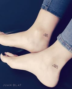 two people with small tattoos on their feet