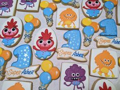 decorated cookies with numbers and cartoon characters on them