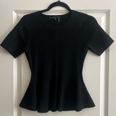 In Never Worn Condition! A Short-Sleeve Sweater With A Figure-Flattering Peplum Crewneck 65% Rayon, 35% Polyester Hand Wash, Dry Flat Measurements: Top To Bottom: 22 1/2” Arm Pit To Arm Pit: 14 1/2” Sleeves Are 8 1/2” Black Short Sleeve Top For Work, Black Fitted Casual Peplum Top, Fitted Black Peplum Top, Elegant Fitted Short Sleeve Top For Spring, Elegant Black Short Sleeve Top For Spring, Chic Crew Neck Short Sleeve Top For Work, Chic Fitted Black Short Sleeve Top, Chic Black Fitted Short Sleeve Top, Black Short Sleeve Top For Spring Workwear