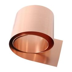 a roll of copper foil sitting on top of a white surface