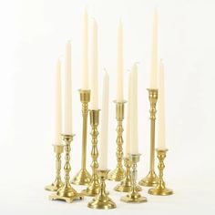 a group of gold candles sitting next to each other