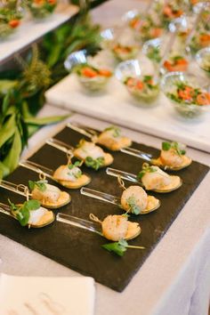 there are many appetizers on the table ready to be eaten at this event