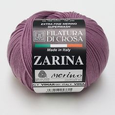 a ball of yarn is shown on a white surface with the words zarna next to it