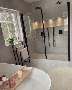 a bathroom with a tub, sink and shower stall in it's own area