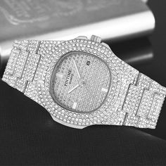 Drop the best, shine your best! This watch is an absolutely stunning timepiece, it looks like it belongs on the wrist of the richest hip hop stars and businessmen alike. You're guaranteed to stand out while rockin' this unique piece. DETAILS Material: 316 Stainless Steel + High-rated cut and quality CZ simulated diamonds Stone Type: High-rated cut and quality CZ simulated diamonds Water Resistance Depth: 30M Dial Thickness: 10MM Dial Diameter: 40MM Clasp Type: Butterfly double snap Grab your ice Classic Fashion Pieces, Iced Out Watch, Hip Hop Watches, Gold Clock, Gold Plated Watch, Diamond Watches For Men, Diamond Ice, Wristwatch Fashion, Gold Watch Men