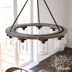 a chandelier with wine glasses hanging from it