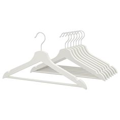 a white suit hanger with five pairs of clothes hanging on the top and bottom