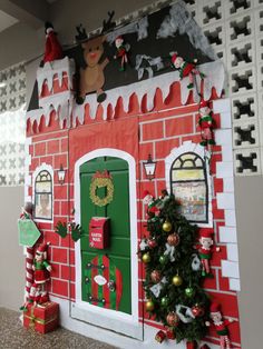 a red and white house decorated with christmas decorations