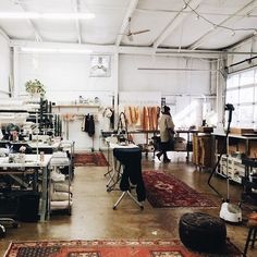 a room filled with lots of furniture and rugs