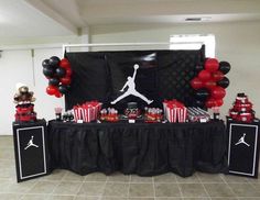 an air jordan themed birthday party with black and red balloons