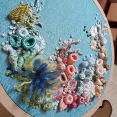 a close up of a embroidery on a table