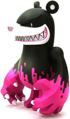 a black and pink toy with big teeth