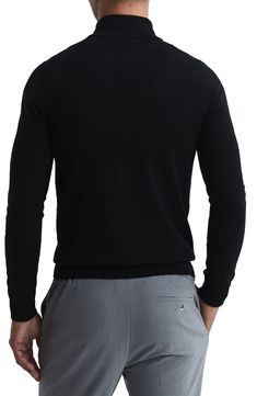 A stand collar and quarter-zip closure bring classy ease to a fitted sweater knit from expertly dyed mélange wool. 26" length (size Small) Stand collar Long sleeves 100% wool Hand wash, dry flat Imported Black Long Sleeve Cashmere Turtleneck, Black Cashmere Long Sleeve Turtleneck, Black Wool Turtleneck With Ribbed Cuffs, Classic Half-zip Sweater With Ribbed Collar, Black Wool Sweater For Business Casual, Black Classic Turtleneck, Classic Wool Half-zip Sweater, Business Winter Long Sleeve Polo Sweater, Black Wool Polo Sweater With Ribbed Collar