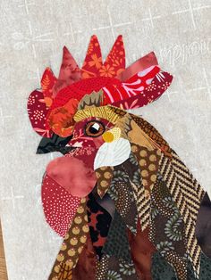 a close up of a rooster made out of fabric