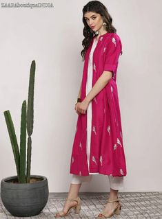 HAND CRAFTED KURTA SET DESCRIPTION *Fuchsia and white printed kurta with trousers *Fuchsia layered straight calf length kurta, has a mandarin collar, three-quarter sleeves, flared hem White solid trousers, drawstring closure *Fabric:- Top fabric: Pure Cotton Bottom fabric: Pure Cotton *Wash Care:- Hand-wash AVAILABLE IN 5 SIZES THEY ARE IN FOLLOWING MEASUREMENTS IN INCHES:- S:- Bust-36/Shoulder-14.5/Top Length-47/Bottom Waist-32/Bottom Length-37/Hip-40 M:- Bust-38/Shoulder-15/Top Length-47/Botto Indian Dress For Women, Shaurya Sanadhya, Ethnic Jacket, Women Ethnic Wear, Indian Dresses For Women, Green Lehenga, Stylish Pants, Indian Dress, Ethnic Dress