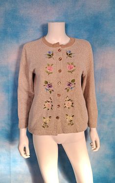 Adorable cottage core AF li'l embroidered granny sweatshirt cardi! It's just darling and would be a perfect spring layering piece. Flecked oatmeal beige french terry with the nap side out, and mirrored embroidered flowers down both sides of the front. Once belonged to a lady named Adeline Berlin. What a name!  Decade: 1990s Label: Bon Worth Material: cotton blend Closure: buttons Vintage Condition: very good to excellent (From a pet and smoke free home) Measurements are taken flat and doubled wh Vintage Embroidered Beige Sweater, Vintage Beige Embroidered Sweater, Vintage Embroidered Cotton Sweater, Vintage Embroidered Fall Sweater, Vintage Embroidered Sweater For Spring, Vintage Embroidered Winter Top, Vintage Embroidered Tops For Fall, Vintage Spring Sweater With Buttons, Pastel Sweatshirt