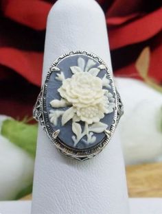 This is a brand new stunning Art Nouveau/Vintage designed sterling silver filigree cameo ring. Choose from a variety of colors and themes. The stunning oval resin cameos are 18mm (just shy of 3/4th of an inch) by 13mm (1/2 inch) in dimension... This ring is 21mm NS on the finger. The inside of the band is marked 925 for sterling. Notice the beautiful filigree swirl like the craftsmanship of the silver setting. Lady Silhouette, Art Deco Flower, Butterfly Vintage, Deco Rose, Antique Filigree, Order Design, London Blue Topaz Ring, Cameo Ring, Flower Rose