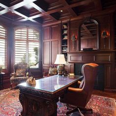 an elegant office with wood paneling and leather chairs