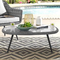 Gather family and friends to indulge in good weather and a premium lounge experience with the Endeavor Outdoor Patio Collection. Sporting a stylish contemporary modern look, Endeavor Outdoor Coffee Table features waterproof, black powder-coated aluminum legs and non-marking foot caps. A designer gray-on-gray tone synthetic rattan weave perfect for upgrading a variety of balcony, garden, backyard, and patio decors make Endeavor Wicker Rattan Patio Coffee Table a vital outdoor decor piece. This patio coffee table installment of the series comes with an easy-to-clean tempered glass table top, providing the ideal surface for resting a plate of hors d?oeuvres, a cocktail or current read. Set Includes: One - Endeavor Coffee Table Wicker Coffee Table, Modern Outdoor Patio, Tempered Glass Table Top, Rattan Weave, Outdoor Coffee Table, Coffee Table Grey, Rattan Coffee Table, Good Weather, Mesa Exterior