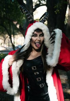 a woman dressed up as santa clause with horns